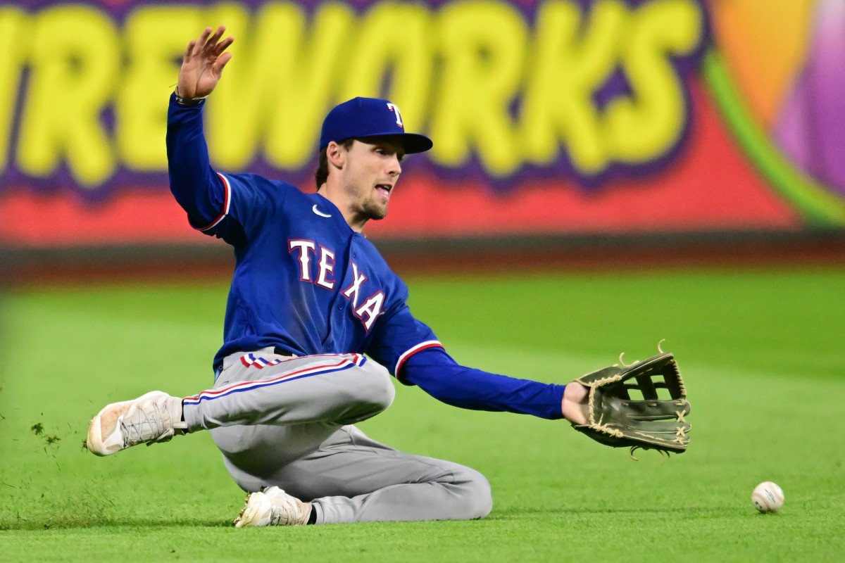 Sep 16, 2023; Cleveland, Ohio, USA; Texas Rangers left fielder Evan Carter (32) can not make the catch of a ball hit by Cleveland Guardians batterTyler Freeman (not pictured) during the eighth inning at Progressive Field. Mandatory Credit: Ken Blaze-USA TODAY Sports
